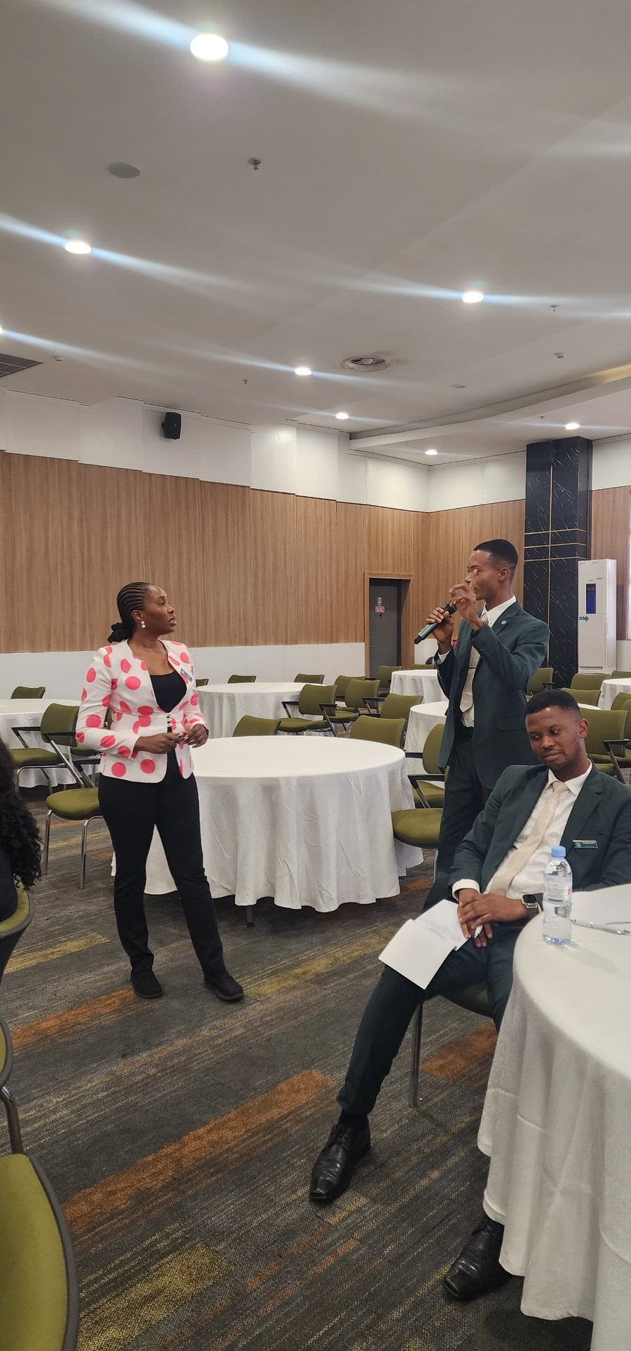 Mary Tom facilitating a discussion with hospitality staff